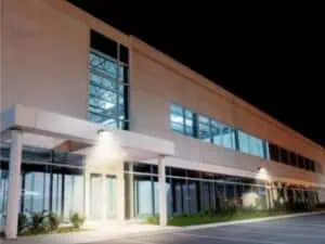 Commercial Outdoor Lighting HALO Outdoor_ALP an exterior view of an office building at night with HALO Outdoor Lights